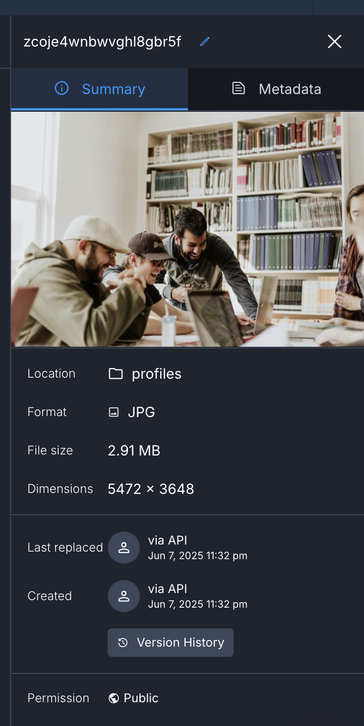 Asset Management Summary tab. Three people are huddled around a laptop and laughing.