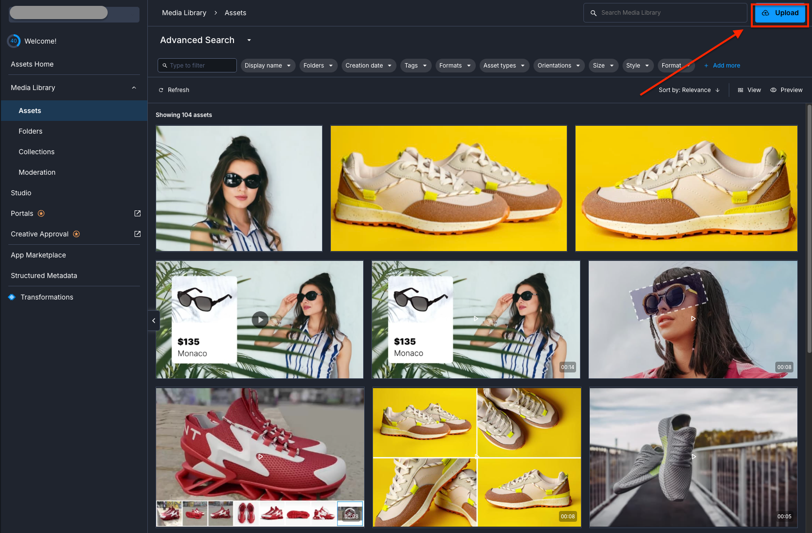 Cloudinary dashboard with the Upload button outlined in red at the top right