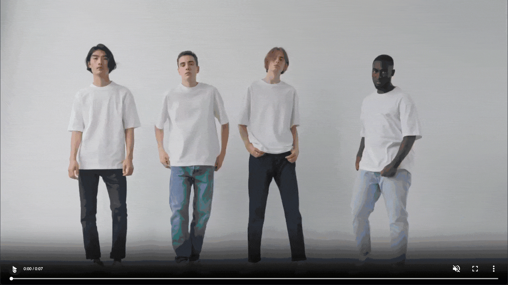 Dynamic overlay demo of "New Arrivals" over a GIF of four men wearing plain white T-shirts and jeans.